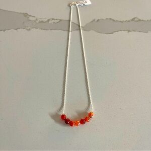 One of a kind faceted Carnelian beads in center of 17”necklace